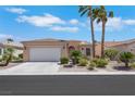 Charming single-story home features desert landscaping, an attached two-car garage, and a tiled roof at 5078 Rivedro St, Las Vegas, NV 89135
