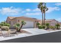 Charming single-story home features desert landscaping, an attached two-car garage, and a tiled roof at 5078 Rivedro St, Las Vegas, NV 89135