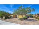 Charming single-story home features a two-car garage, beautiful desert landscaping, and gated entry at 6975 Hopi Summit Ct, Las Vegas, NV 89149