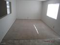 Carpeted bedroom with natural light from two windows at 7309 Sunspot Dr, Las Vegas, NV 89128