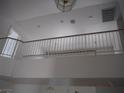 Second floor loft area featuring white railings and overhead lighting at 7309 Sunspot Dr, Las Vegas, NV 89128