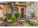 Charming home exterior featuring a welcoming front porch with decorative details and a swing at 7352 Rietz Canyon St, Las Vegas, NV 89131