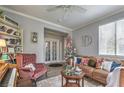 Bright and stylish living room with comfortable seating, a fireplace, and decorative accents at 7352 Rietz Canyon St, Las Vegas, NV 89131