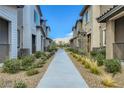 View of the complex showing the walkway and landscaping at 7360 N Decatur Blvd # 1, Las Vegas, NV 89131