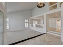Spacious living room featuring high ceilings, neutral carpeting, and elegant chandelier at 7619 Belgian Lion St, Las Vegas, NV 89139