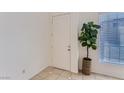 Bright entryway featuring tiled floors, neutral walls, and a decorative plant at 8143 Retriever Ave, Las Vegas, NV 89147