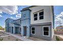Modern townhome showcasing clean lines, modern color scheme, and well-maintained landscaping at 9330 Soothing Sea St # Lot 92, Las Vegas, NV 89178