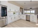 Modern kitchen features white cabinets, stainless steel appliances, and an open design at , Las Vegas, NV 89134