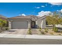 Charming single story home with a two car garage and appealing low maintenance desert landscaping in front at 10456 Skye Arroyo Ave, Las Vegas, NV 89166