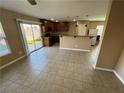 Open-concept kitchen and dining area with sliding glass doors to the backyard at 1155 Paradise Safari Dr, Henderson, NV 89002