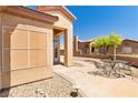 Charming patio with outdoor seating, a stucco wall, and desert-style landscaping at 1204 Golf Club, Laughlin, NV 89029