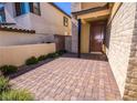 Beautiful walkway leading to the front door, complemented by stone and desert landscaping at 12101 Arrebol Ave, Las Vegas, NV 89138