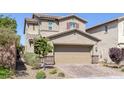 Charming two-story home with a brick driveway and well-maintained landscaping at 2827 Turnstone Ridge St, Henderson, NV 89044