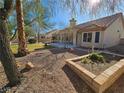 Spacious backyard area featuring desert landscaping and block wall surround at 3104 Archwood Way, Las Vegas, NV 89134