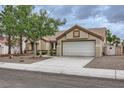 Beautiful single-story home featuring a two car garage and well-kept desert landscaping at 3104 Archwood Way, Las Vegas, NV 89134