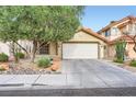 Charming single-story home with a well-maintained yard and a two-car garage at 314 Abbington St, Henderson, NV 89074