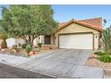 Charming single-story home with a well-maintained yard and a two-car garage at 314 Abbington St, Henderson, NV 89074