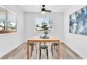 Cozy dining room with natural light, a modern ceiling fan, and a view of the outdoors at 3151 Soaring Gulls Dr # 2136, Las Vegas, NV 89128