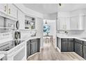 Well-lit kitchen with sleek black and white cabinets, stainless steel appliances, and modern countertops at 3151 Soaring Gulls Dr # 2136, Las Vegas, NV 89128