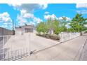 Inviting single-story home with a long driveway and secure gated access at 45 Prince Ln, Las Vegas, NV 89110