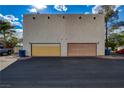 Two-car garage with a private driveway for convenient parking at 611 Spyglass Ln, Las Vegas, NV 89107