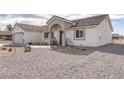 Well-maintained home featuring neutral-toned exterior and low-maintenance gravel yard at 681 Indian Wells Ct, Pahrump, NV 89060