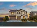 Beautiful two-story home featuring a three-car garage and landscaped front yard at 7364 Marbury St, Las Vegas, NV 89166