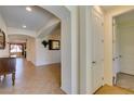 Open hallway showcasing tiled flooring, arched doorways, and stylish interior design at 768 Flowing Meadow Dr, Henderson, NV 89014