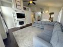 Spacious living room with a cozy fireplace and a comfortable gray sectional sofa, great for relaxing at , Las Vegas, NV 89129
