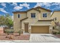 Inviting two-story home featuring a cozy landscape, neutral stucco, and a convenient two-car garage with brown door at 10513 Bandera Mountain Ln, Las Vegas, NV 89166