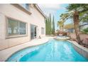 Inviting backyard pool and spa, perfect for outdoor relaxation and entertaining, with desert landscaping at 10613 Turquoise Valley Dr, Las Vegas, NV 89144