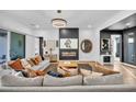 Spacious living room with modern fireplace, stylish furniture, and ample natural light at 11954 Camden Ridge Ct, Las Vegas, NV 89138