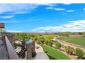 Expansive backyard with meticulously landscaped yard, fire pit, pool and golf course views at 1472 Macdonald Ranch Dr, Henderson, NV 89012
