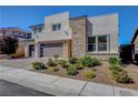 Charming exterior view of a two-story home showcasing desert landscaping and modern architecture at 2579 Speyburn Ave, Henderson, NV 89044