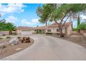 Charming single-story home with a large circular driveway and a two-car garage at 3065 S Torrey Pines Dr, Las Vegas, NV 89146