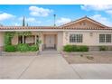 Inviting front entrance with a well-maintained lawn and brick accents at 3065 S Torrey Pines Dr, Las Vegas, NV 89146