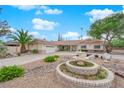 Beautiful single-story home featuring a circular driveway and a charming water fountain at 3065 S Torrey Pines Dr, Las Vegas, NV 89146