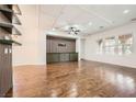 Open-concept living room with hardwood floors and custom built-in cabinets at 3198 Stella Cilento Ave, Henderson, NV 89044