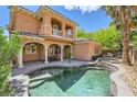 Beautiful backyard with a serene pool, spa, covered patio and outdoor dining area at 3198 Stella Cilento Ave, Henderson, NV 89044