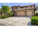 Two-story home featuring a three car garage and neutral color palette at 4017 Kristina Lynn Ave, North Las Vegas, NV 89081