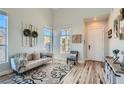 Bright living room featuring hardwood floors, neutral tones, and stylish decor at 7337 Savannah Falls St, Las Vegas, NV 89131