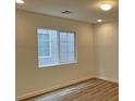 Bright bedroom with recessed lighting, fresh paint, and new laminate flooring at 7412 Bewitching Ct, Las Vegas, NV 89149