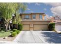 Charming two-story home with landscaped yard, mature tree and a spacious two-car garage and large driveway at 7736 Villa Andrade Ave, Las Vegas, NV 89131