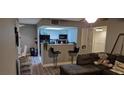 Open-concept living area with breakfast bar seating at 8070 W Russell Rd # 1105, Las Vegas, NV 89113