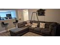 Comfortable sectional sofa and breakfast bar enhance this living room at 8070 W Russell Rd # 1105, Las Vegas, NV 89113