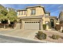 Charming two-story home with a three-car garage and well-maintained landscaping at 10680 Sapphire Vista Ave, Las Vegas, NV 89144