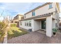 Spacious backyard featuring a brick patio, manicured lawn, and ample space for outdoor entertaining at 16 Cresta Villa Ct, Henderson, NV 89011