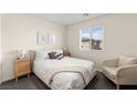 Comfortable bedroom with natural light, neutral tones, and stylish furnishings at 1783 Matteo Cove Pl, North Las Vegas, NV 89084