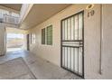 Apartment exterior showcasing tan paint and metal door at 212 Orland St # 19, Las Vegas, NV 89107