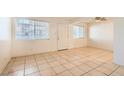 An airy living room with tile floors, neutral paint, and natural light at 212 Orland St # 19, Las Vegas, NV 89107